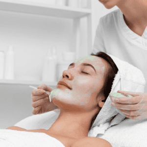 a woman getting a facial mask